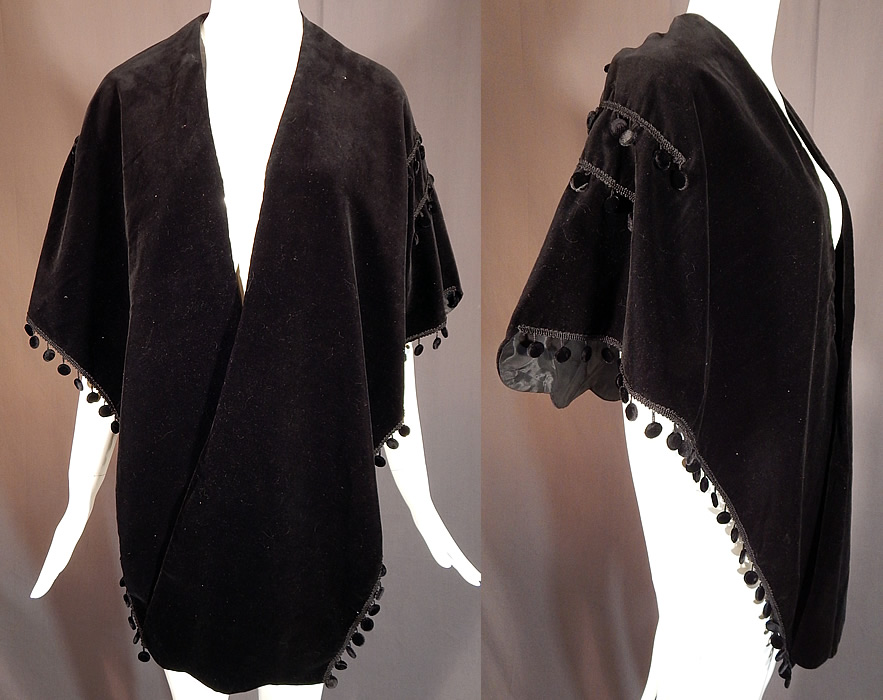 Vintage Taffy's of California Black Velvet Fringe Trim Evening Wrap Stole Shawl
This elegant evening wrap stole shawl has a cape style, with long pointed ends on the front, fringe trim around the bottom and back, an open front with no closure and is fully lined. There is an "Exclusively Taffy's of California" label sewn inside. The wrap measures 73 inches wide across the top and 19 inches long in the center. 