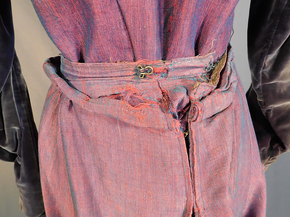 Victorian Red Blue Violet Velvet Wool Mutton Sleeve Bodice Skirt Gown
The skirt measures 39 inches long, with a 22 inch waist. It is in good as-is condition, with some small faint stains, a couple of moth holes and some fraying, alteration on the back waist closure just on the skirt and only some slight fade discoloration on the velvet trim top. This is truly a unique color fabric piece of antique Victoriana wearable art! 