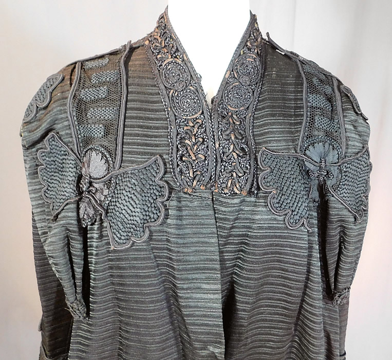 Edwardian Black Silk Soutache Braided Rope Passementerie Trim Long Evening Coat
This antique Edwardian era black silk soutache braided rope passementerie trim long evening coat dates from 1910. It is made of a heavy black silk grosgrain ribbed textured fabric, with black silk soutache braided rope, woven passementerie trim accents. 