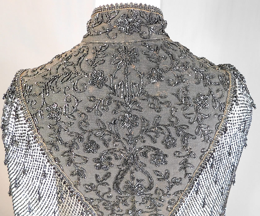 Victorian Black Silk Jet Beaded Fringe Mesh Mantle Dolman Pelerine Cloak Cape
The cape measures 21 inches long, with a 40 inch bust, 14 inch back and a 12 inch neck. 