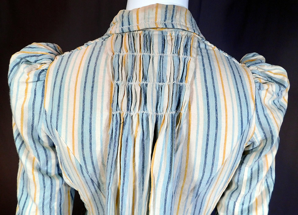 Victorian Striped Print Flannel Wool Watteau Wrapper Workwear Morning Dress
It is in good as-is condition, with a few tiny moth holes on the skirt, some faint soiling, stains on the inside back collar and inside cotton lining top.