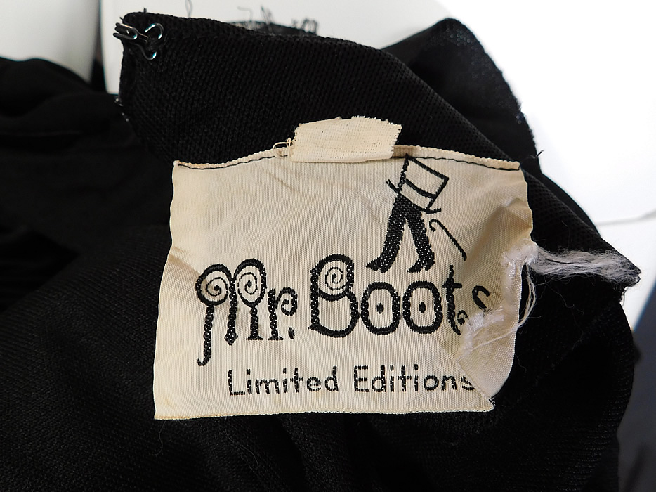 Vintage Mr. Boots Limited Editions Black Knit Neon Butterfly Mod Maxi Dress
There is a "Mr. Boots Limited Editions" label and size 5 tag sewn inside. The dress measures 56 inches long, with a 36 inch bust, 26 inch waist, 36 inch hips, 22 inch long sleeves and a 14 inch back. It is in good condition. This is truly a wonderful piece of retro mod hippie wearable art! 