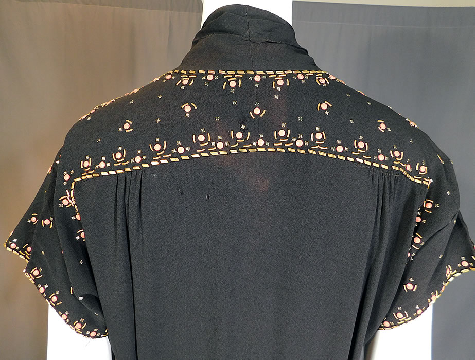 Vintage Black Silk Charmeuse Gold Studded Coral Rhinestone Beaded Cocktail Dress
The dress measures 43 inches long, with a 38 inch bust, 32 inch waist and 42 inch hips.