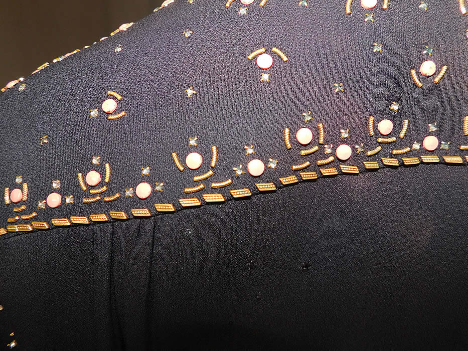 Vintage Black Silk Charmeuse Gold Studded Coral Rhinestone Beaded Cocktail Dress
It is in good as-is condition, with a three tiny pin holes and a small faded discoloration spot on the back top (see close-ups). 