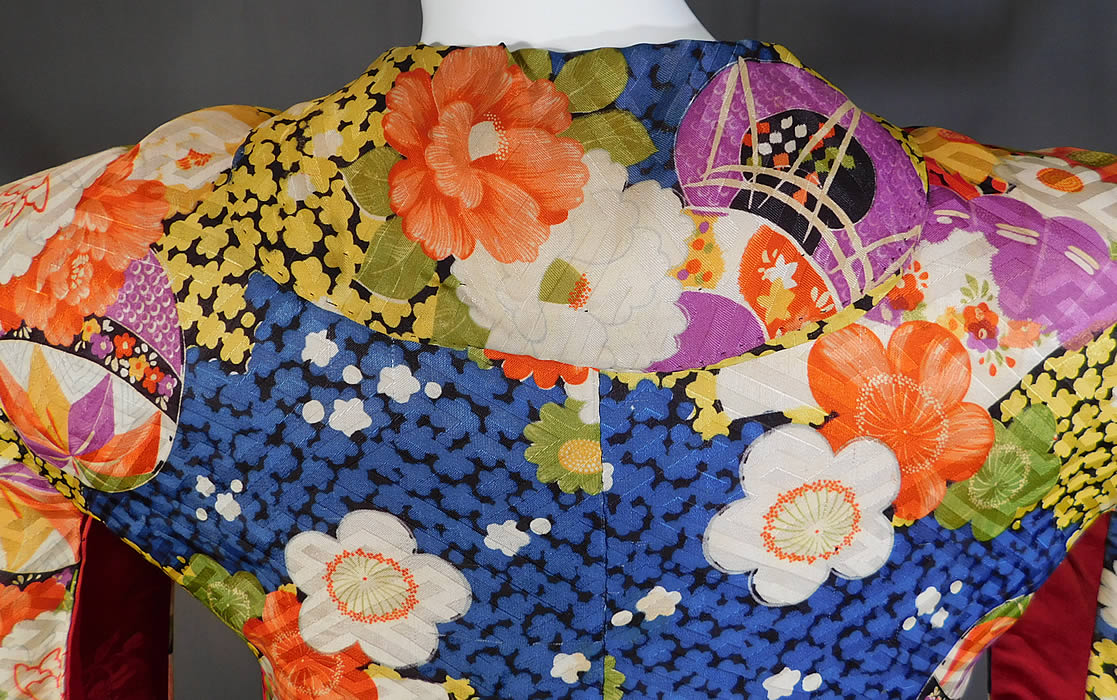 Vintage Japanese Colorful Floral Fan Silk Screen Haori Kimono Robe Jacket
The kimono measures 28 inches long, with a 38 inch chest, 38 inch waist, 25 inch long kimono sleeves and a 19 inch back.