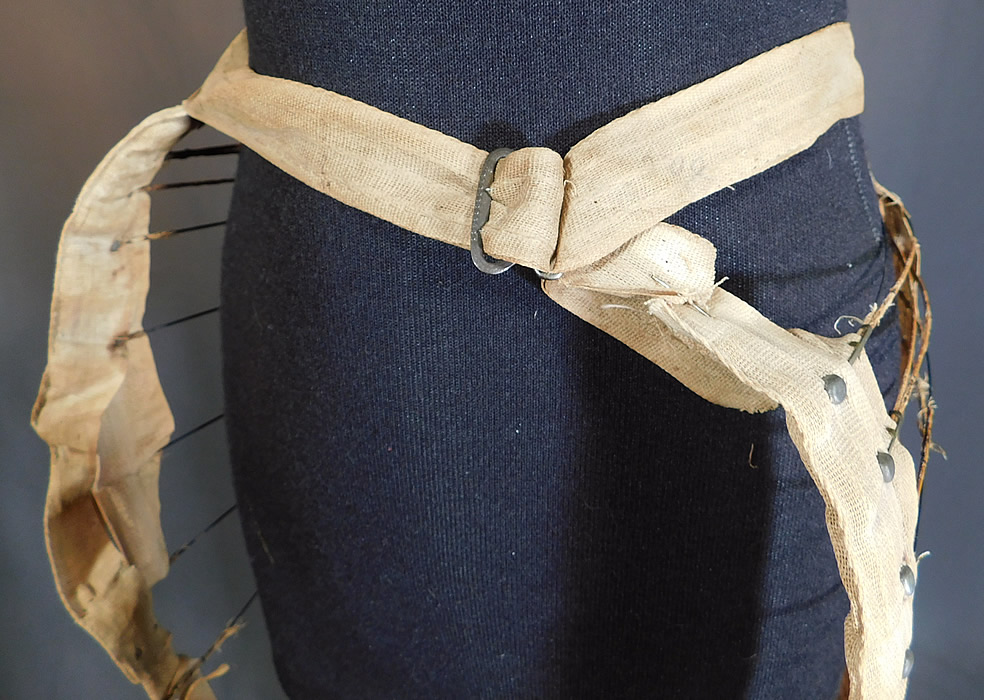 Victorian Bustle Back Wire Hoop Crinoline Cage Petticoat Skirt Support
It is in fair as-is condition needing some restoration repairs, with frayed linen tape exposing the wire underneath, a frayed waistband strap attached with safety pin and has a broken missing piece of wire on the front (see close-ups). This is truly a rare and wonderful piece of antique Victoriana structured underpinning wearable art!
