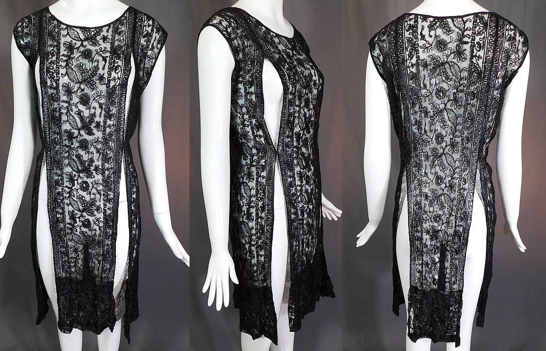 Vintage Black Net Tambour Embroidery Lace Tabard High Slit Chemise Shift Dress
This vintage black net tambour embroidery lace tabard high slit chemise shift dress dates from the 1920s. It is made of a sheer black tulle net fabric, with tambour embroidery work done in a floral vine leaf design and Greek key meander decorative border pattern.