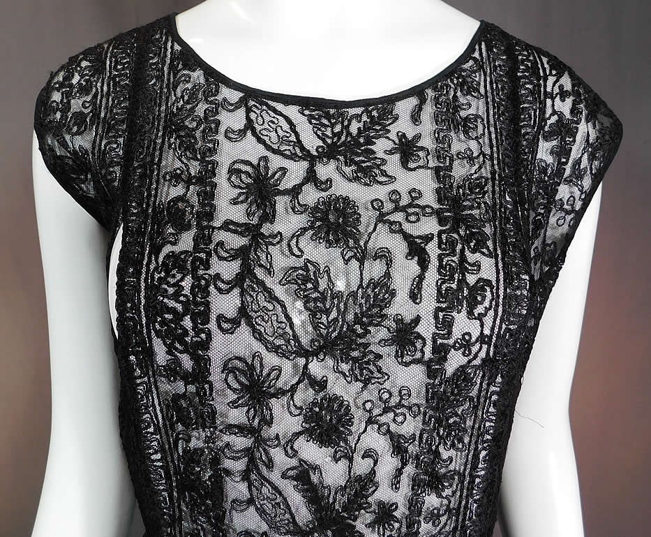Vintage Black Net Tambour Embroidery Lace Tabard High Slit Chemise Shift Dress
This lovely lace chemise tabard style shift dress is loose fitting, has open cut out split panels stitched together at the waist, with high slits along the skirt sides, sleeveless and is sheer, unlined.