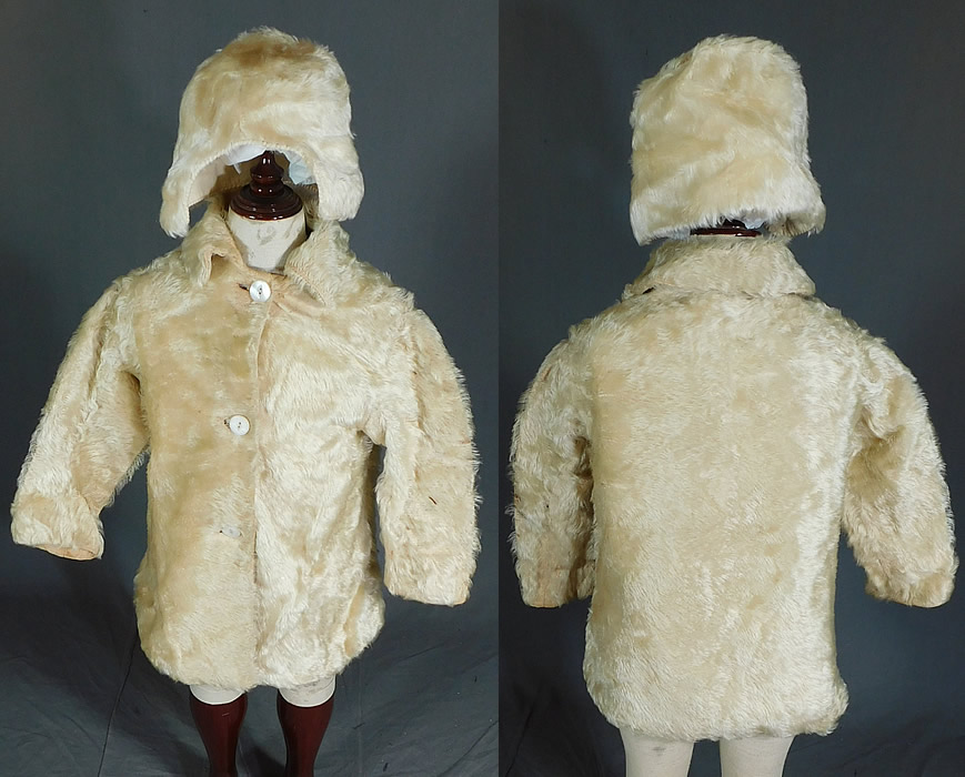 Victorian Childrens Curly White Mohair Fur Winter Coat & Cap Hat
This antique Victorian era children's curly white mohair fur winter coat and cap hat dates from 1900. It is made of an off white cream color soft curly mohair fur wool fabric. This charming child's warm winter outfit includes a coat, with fold over collar, long sleeves, mother of pearl button closures and is fully lined in a cotton fabric.
