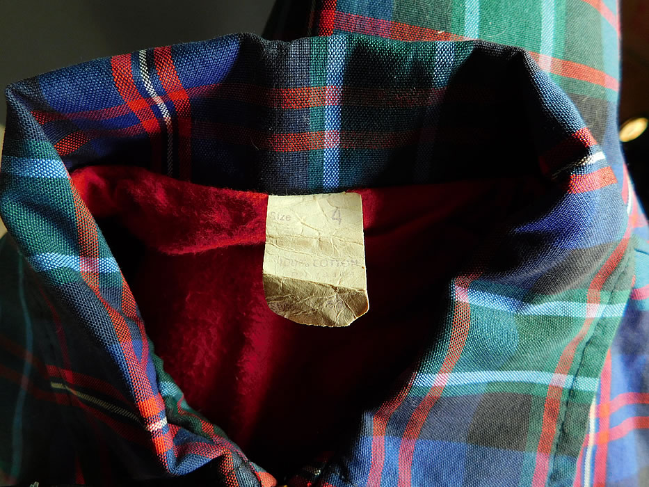 Vintage Childs Cotton Plaid Tartan Boys Retro Rockabilly Ricky Jacket
This retro rockabilly Ricky style child's jacket has a zipper front closure, long sleeves, front side slit pockets, elastic side gathering on the waist and is fully lined in a red soft flannel fabric with a size 4 tag sewn inside.