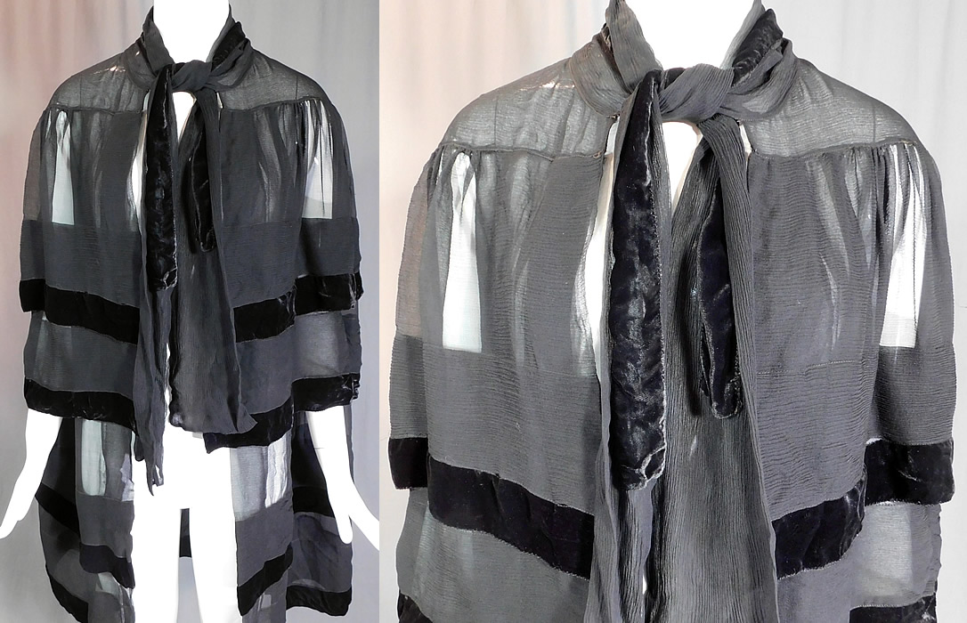 Vintage Art Deco Black Silk Chiffon Velvet Trim Flapper Evening Cloak Cape
This vintage Art Deco black silk chiffon velvet trim flapper evening cloak cape dates from the 1920s. It is made of a black sheer silk crepe chiffon fabric with black velvet trim edging. This fabulous flapper evening cloak cape is a long mid length, with a layered tiered capelet style, side arm hole opening slits, a scarf tie closure at the neck and is sheer, unlined.