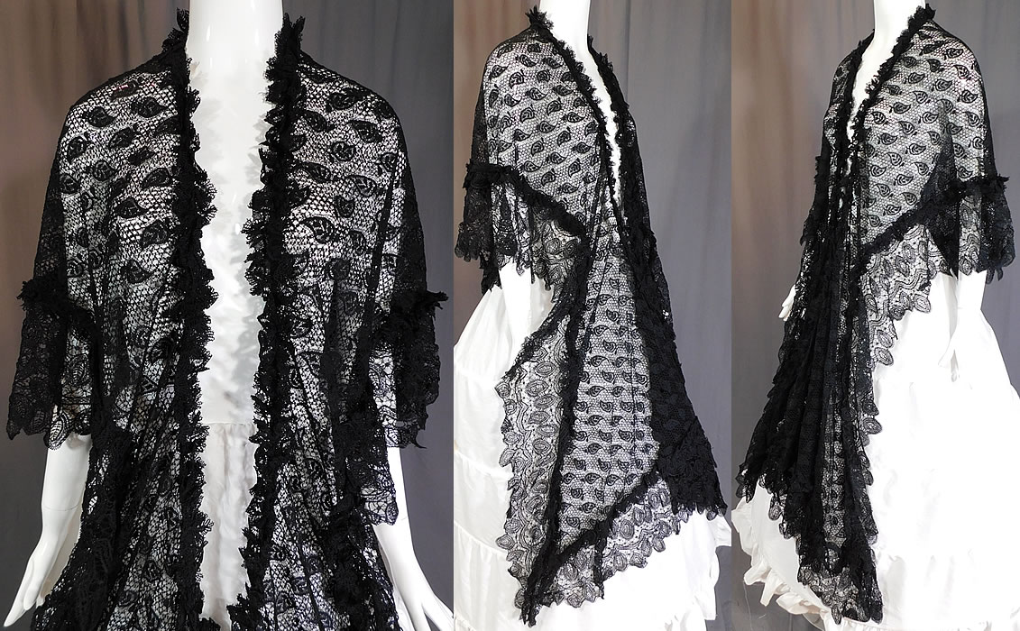 Victorian Antique Black Lace Dolman Mantle Pelerine Shawl Cloak Cape
This lovely lace large dolman mantle pelerine shawl style cloak cape has a ruffled trim edging, scalloped lace trim bottom, with long lappet ends, an open front with no closure and is sheer, unlined. 