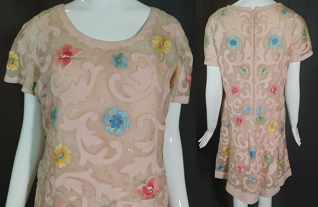 Vintage Samuel Winston by Roxane Pink Pastel Floral Embroidered Mini Dress
This pretty pink mini dress has a short above the knee length, short cap sleeves, a straight shift style with drop waist, back zipper closure and is fully lined.
