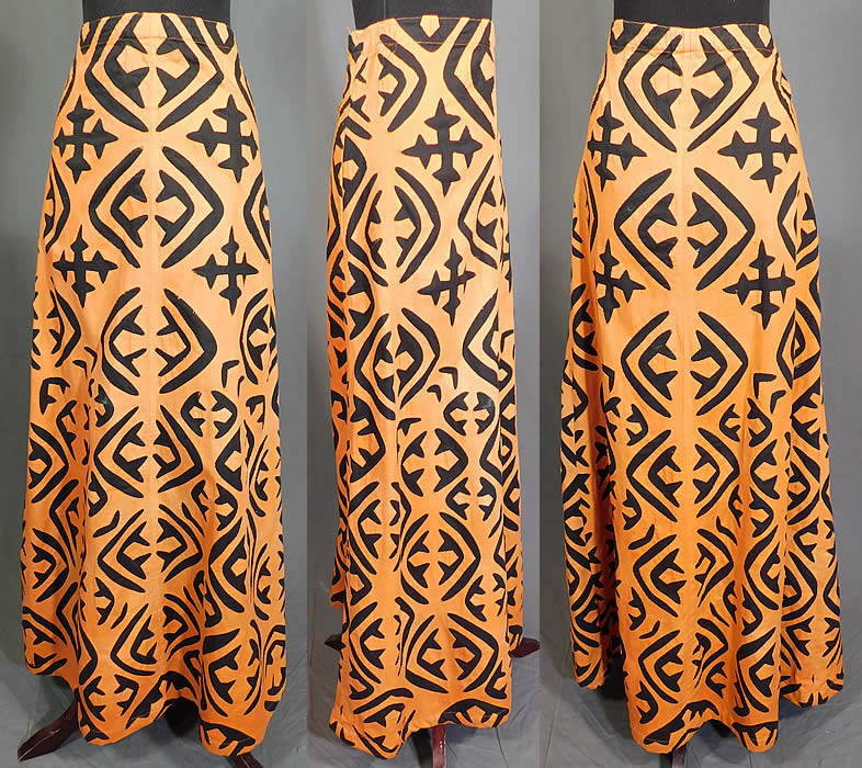 Vintage Antique Hawaiian Applique Quilt Cutout Fabric Boho Hippie Maxi Skirt
This vintage antique Hawaiian applique quilt cutout fabric boho hippie maxi skirt dates from the 1960s. It is made of an orange and black cotton fabric with a cutout background hand stitched applique work creating a radially symmetric pattern bold design distinctive of the quilting styles of the Hawaiian islands. This beautiful boho style maxi skirt is a long floor length, with side zipper closure and is unlined.