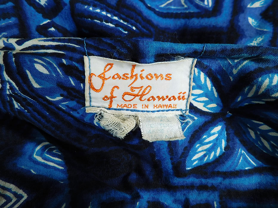 Vintage Fashions of Hawaii Blue Hawaiian Polynesian Print Cotton Shift Dress
There is a "Fashions of Hawaii Made in Hawaii" label sewn inside. The dress measures 38 inches long, with a 38 inch bust, 36 inch waist and 38 inch hips. It is in excellent condition. This is truly a wonderful piece of vintage Hawaiiana wearable art! 