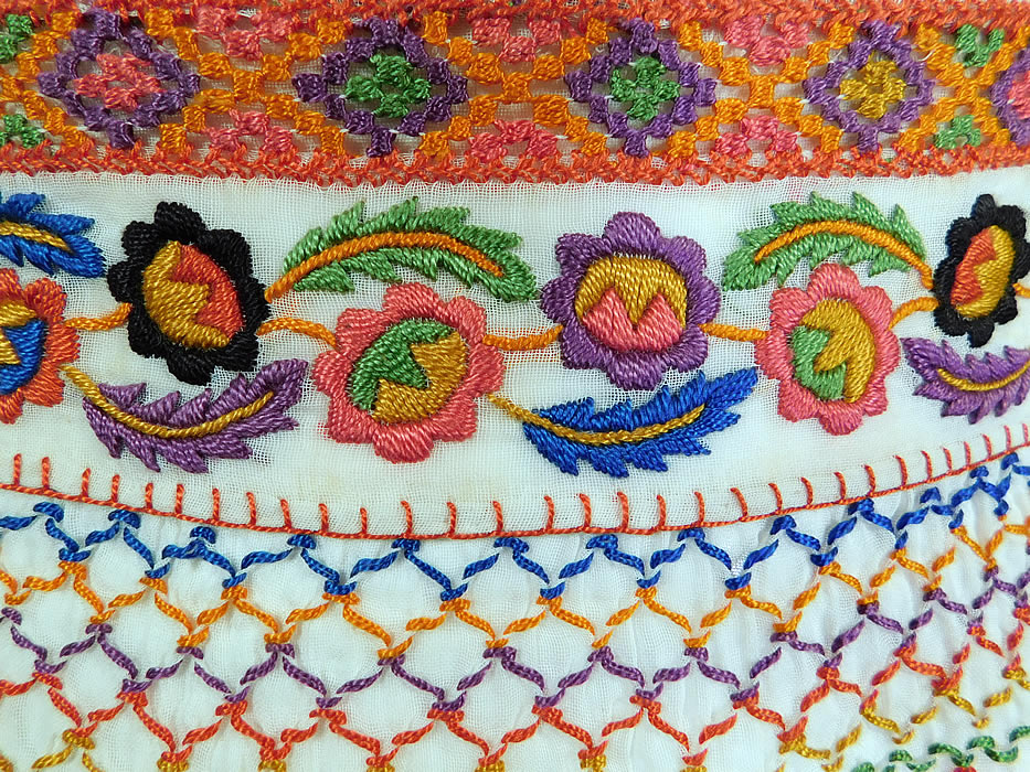 Vintage White Cotton Colorful Floral Embroidered Smocking Boho Peasant Half Apron Skirt
This pretty peasant bohemian Hungarian Czech folk costume half waist apron style skirt has a back waist tie strap closure and is sheer unlined. 