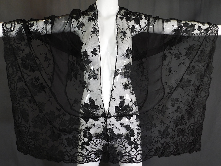 Vintage Sheer Black Silk Chiffon Grape Leaf Vine Pattern Lace Stole Mantilla Shawl
It is made of a sheer black silk chiffon fabric insert down the center and a sheer black lace fabric with a grape vine leaf pattern design outlined in black threads with detailed shading effects a beautiful decorative scalloped border edging.