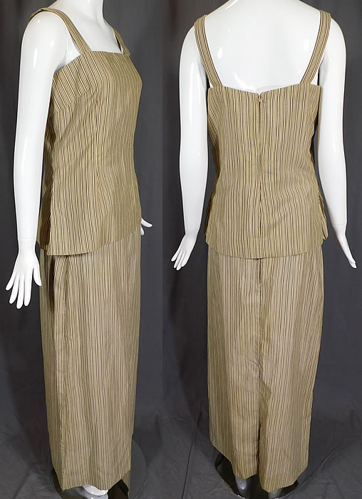 Vintage Mr. John I. Magnin & Co. Striped Seersucker Maxi Dress Skirt Top Set
The top measures 25 inches long, with a 36 inch bust and 28 inch waist. There is a matching fabric long floor length maxi skirt, with a back slit, fitted waistband with gold lame trim edging inside, a back zipper closure and is fully lined. The skirt measures 41 inches long, with a 30 inch waist and 42 inch hips.