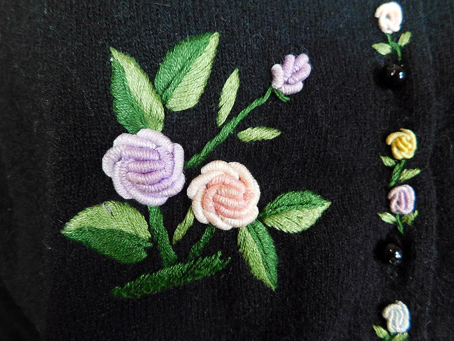 Vintage Hong Kong Black Lambswool Angora Rabbit Rosette Embroidered Sweater
.It is made of a black lambswool, angora rabbit hair knit fabric with pastel raised French knot twisted woven wheel stitch hand embroidery work rosette flowers and padded satin stitch embroidered green ombre leaves.