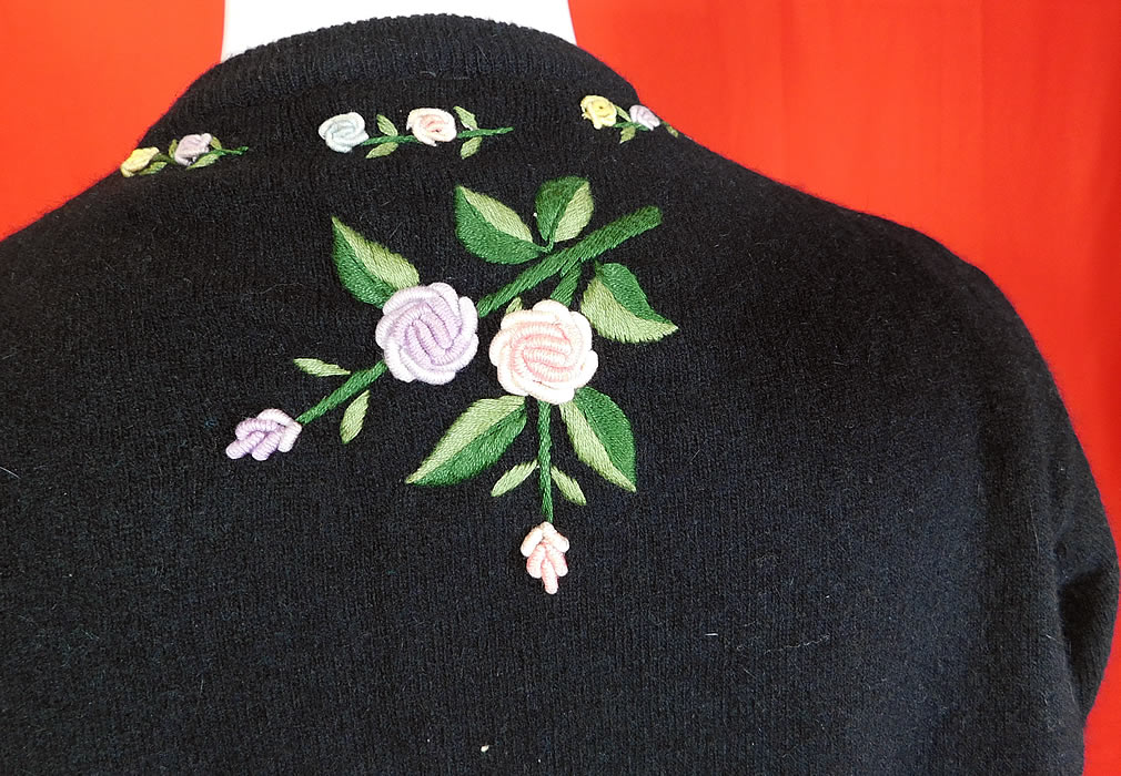 Vintage Hong Kong Black Lambswool Angora Rabbit Rosette Embroidered Sweater
The sweater measures 22 inches long, with a 42 inch bust, 34 inch waist, 16 inch back and 22 inch long sleeves.