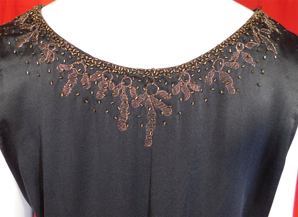 Vintage Art Deco Black Silk Gold Beaded Lame Embroidered Flapper Dress
The dress measures 39 inches long, with a 40 inch bust, 44 inch waist and 44 inch hips. The dress is in excellent condition. This is truly an exceptional piece of Art Deco wearable art! 