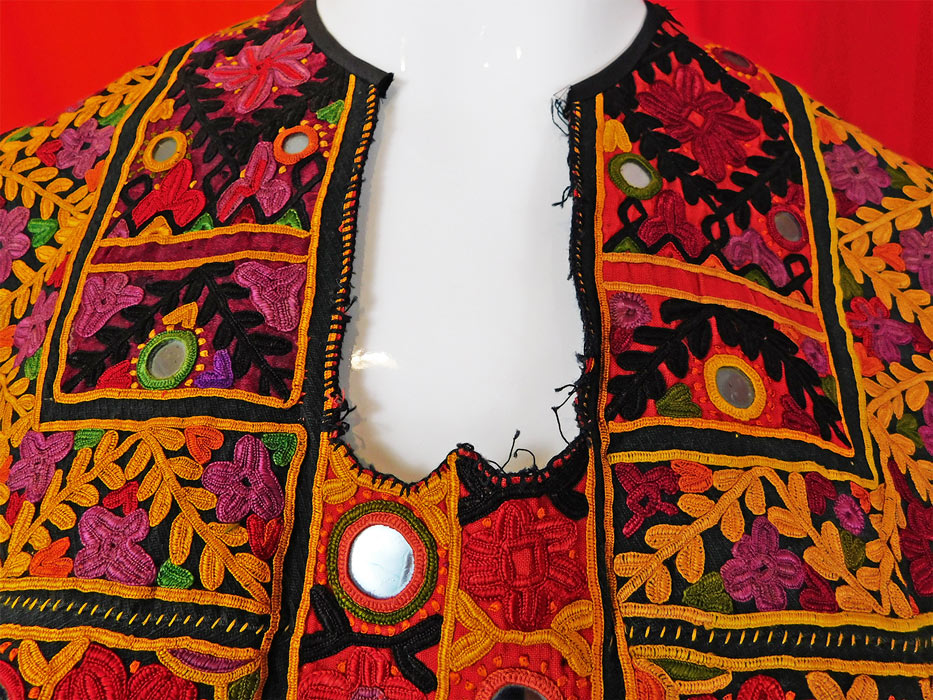 Vintage Indian Gujarati Kutch Work Ethnic Embroidered Mirror Boho Bib Top
There are small mirrors embroidered into the decorative designs. This stunning handmade hand embroidered dress trim bib top has a dickey front insert style with an open back, halter top neck with single button closure and is unlined.