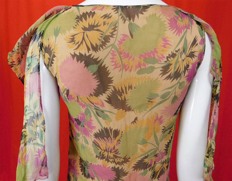Vintage Floral Pastel Print Silk Chiffon Smocking Shawl Collar Drop Waist Dress
The dress measures 40 inches long, with a 34 inch bust, 30 inch waist and 36 inch hips. It is in good condition, with only a tiny frayed hole on the back scarf. This is truly a wonderful piece of wearable art! 