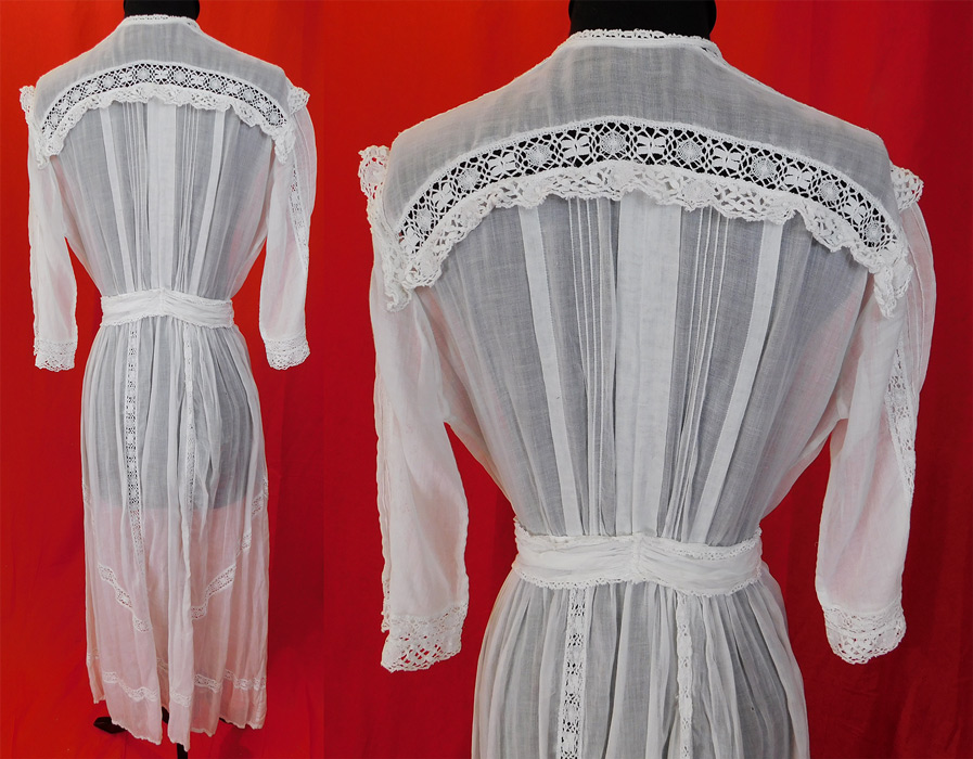 Edwardian White Cotton Batiste Cluny Torchon Bobbin Lace Lawn Dress Tea Gown
This lovely lace lawn dress is a long tea length, with lace trimmed sailor collar, a fitted waist with attached belted tie sash, 3/4 length sleeves, button closures along the front side and is sheer, unlined. 