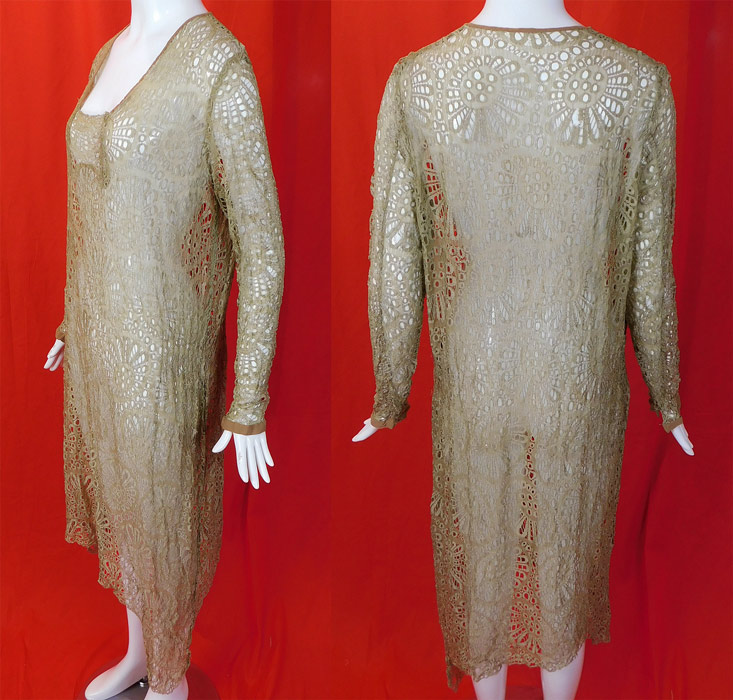 Vintage Beige Ecru Sheer Silk Eyelet Drawn Cutwork Lace Handkerchief Hem Dress
This lovely lace dress has a loose fitting drop waist style with an uneven asymmetrical handkerchief hemline skirt, long tapered sleeves with snap closure cuffs, a squared neckline and is sheer, unlined. 