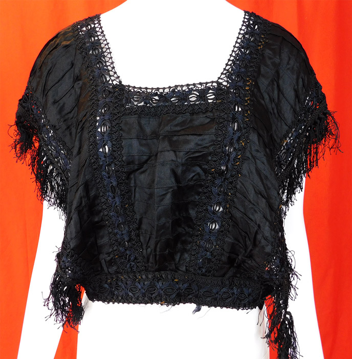 Victorian Black Silk Ruched Pleated Lace Fringe Trim Blouse Bodice Tabard Top
This beautiful bodice blouse top has a tabard style sleeveless with open sides, a fitted lace trim waistband missing the side closure, a squared neckline and is unlined.