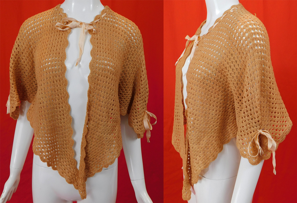 Edwardian Pink Hand Knit Crochet Wool Ribbon Morning Robe Bed Jacket Cape
This antique Edwardian era pink hand knit crochet wool ribbon morning robe bed jacket cape dates from 1915. It is made of a pink hand knit crochet wool yarn with pink silk grosgrain ribbon drawstring trim accents. 