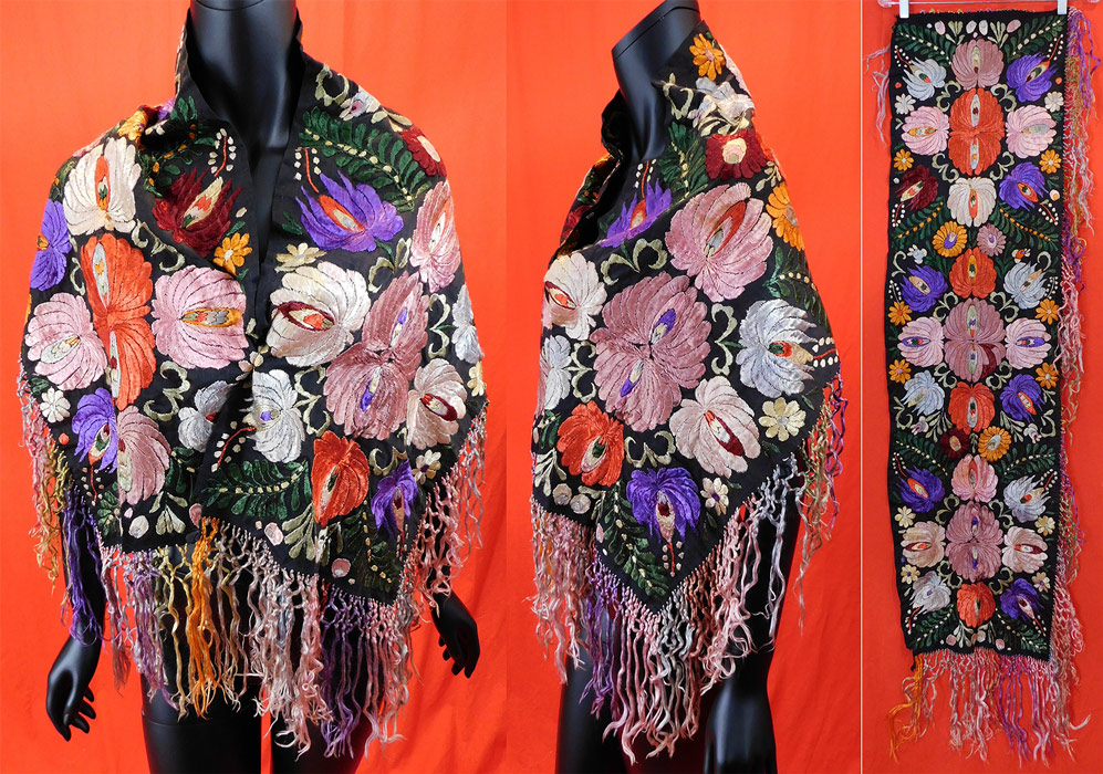 Vintage Matyo Hungarian Folk Embroidery Colorful Floral Shawl Stole Scarf
This vintage Hungarian Matyo folk embroidery colorful floral shawl stole scarf dates from the 1920s. It is hand stitched, made of multi colored silk threads done in a raised padded satin stitch Matyo embroidery work on a black cotton fabric underneath. There sensational shawl stole style scarf has an embroidered floral leaf design, hand knotted multi color silk fringe trim edging along the bottom, sides and is unlined. 