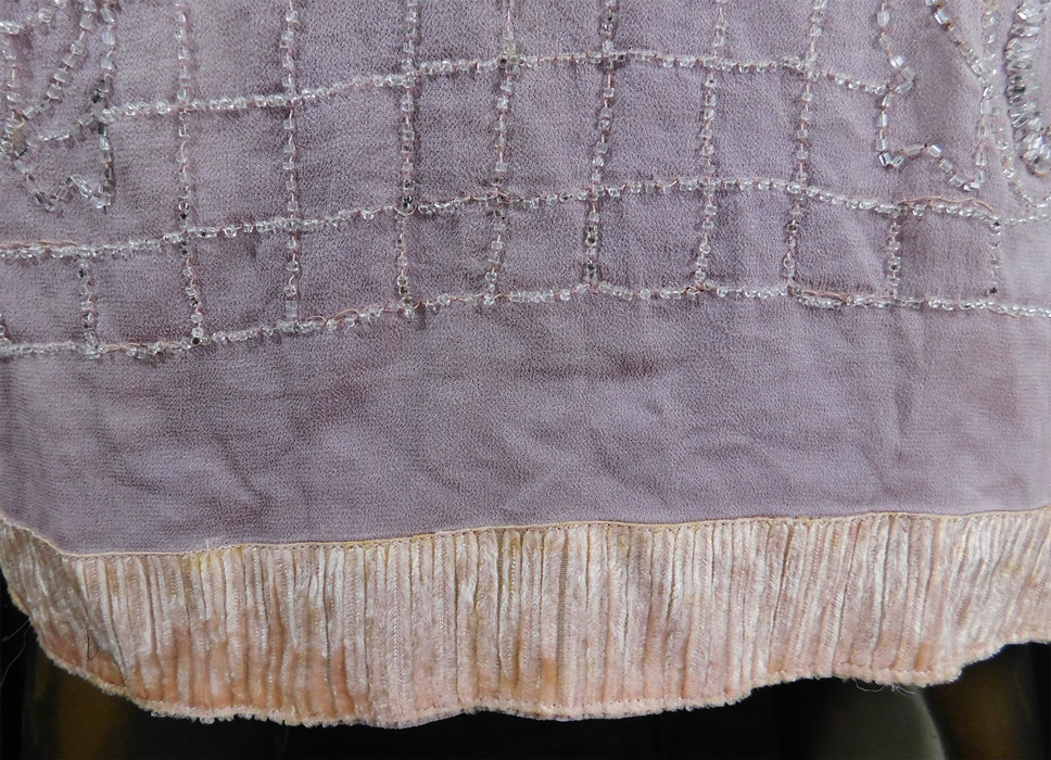 Vintage Art Deco Lilac Pink Sheer Silk Chiffon Crystal Beaded Flapper Dress
This vintage Art Deco lilac pink sheer silk chiffon crystal beaded flapper dress dates from the 1920s.