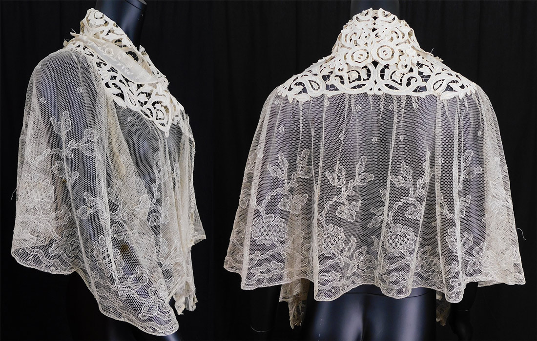 Victorian Cream Embroidered Net Tape Lace Shawl Collar Cloak Cape Pelerine
This lovely lace shawl style pelerine cloak cape is mid length with pointed ends down the center front, has an open front with no closure, a decorative lace trimmed fold over collar and is sheer, unlined. 