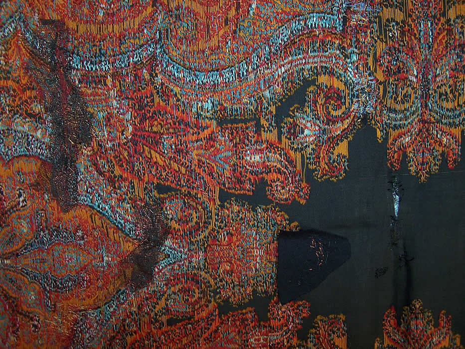 Victorian Antique Large Banquet Size Jacquard Hand Loom Wool Paisley Shawl extreme Close up. a small frayed split in the center and several small rewoven repairs and patches near the center 
