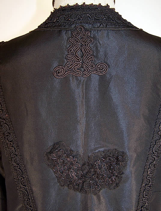 Edwardian Black Silk Taffeta Soutache Trim Walking Suit Jacket back a small patched repair on the back which has been covered with a black lace applique close up.