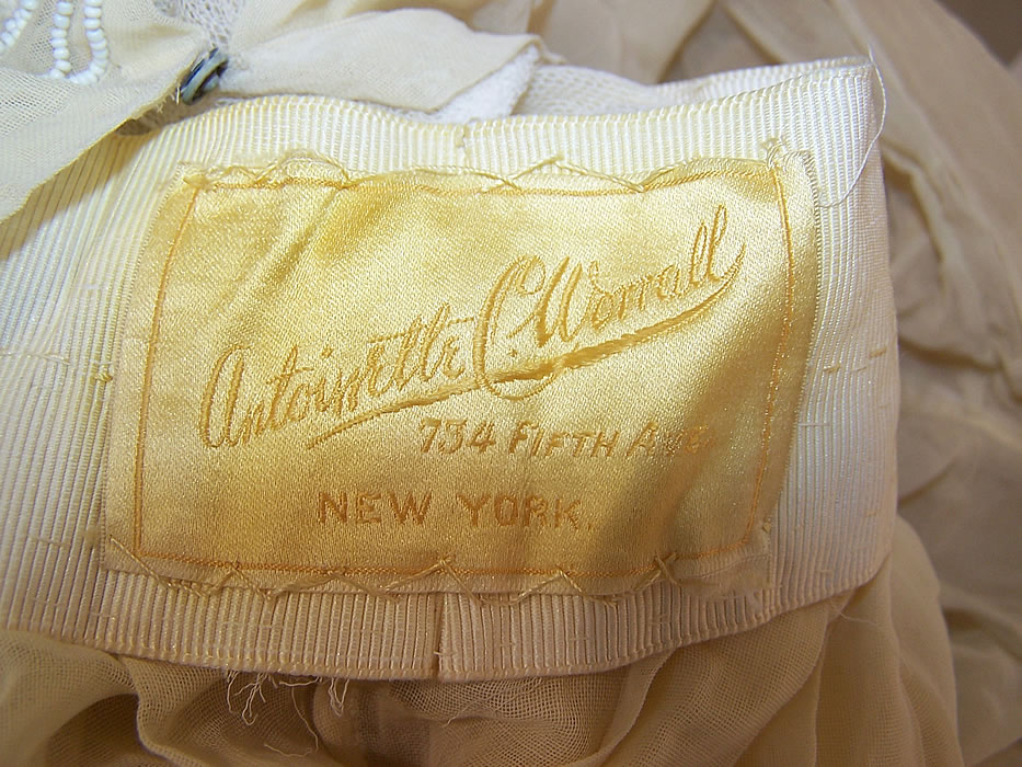 Edwardian Titanic Antoinette C. Worrall Yellow Muslin White Beaded Dress label close up.