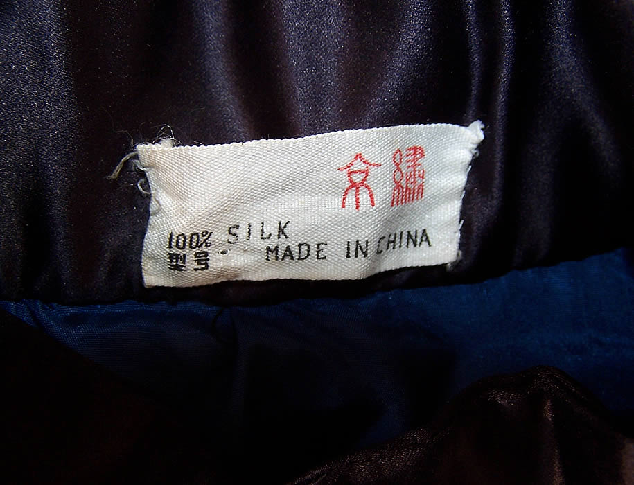  Vintage Chinese Dragon Embroidered Roundel Black Silk Robe Coat label close up.