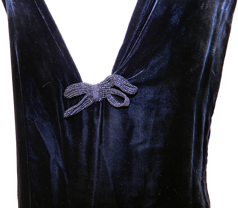 Vintage Black Silk Velvet Chantilly Lace Bias Cut Evening Gown Dress This sexy siren evening gown has a bias cut, long floor length skirt, sleeveless, with an asymmetrical front neckline, plunging V back and side snaps closure.