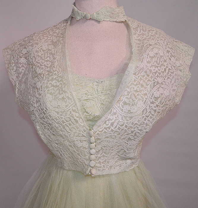Vintage Harlene Design Mint Green Lace Tulle Net Strapless Formal Dress & Jacket. There is a matching mint green lace tulle net short cropped bolero jacket, with choker collar button closure at the neck, open front and lace covered button closures at the bottom. The jacket measures 15 inches long, with a 36 inch bust. Both are in good condition, but have not been cleaned. 
