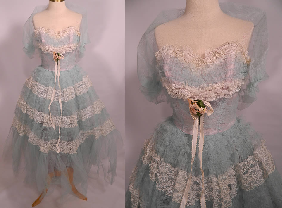 Vintage White Lace Blue Ruffle Tulle Net Strapless Formal Cupcake Dress & Shrug. This vintage white lace blue ruffle tulle net strapless formal cupcake dress and shrug dates from the 1950s. It is made of a pale pastel light baby blue color taffeta fabric lining, with a matching color sheer tulle net ruffle fabric overlay and white lace ruffle trim. 