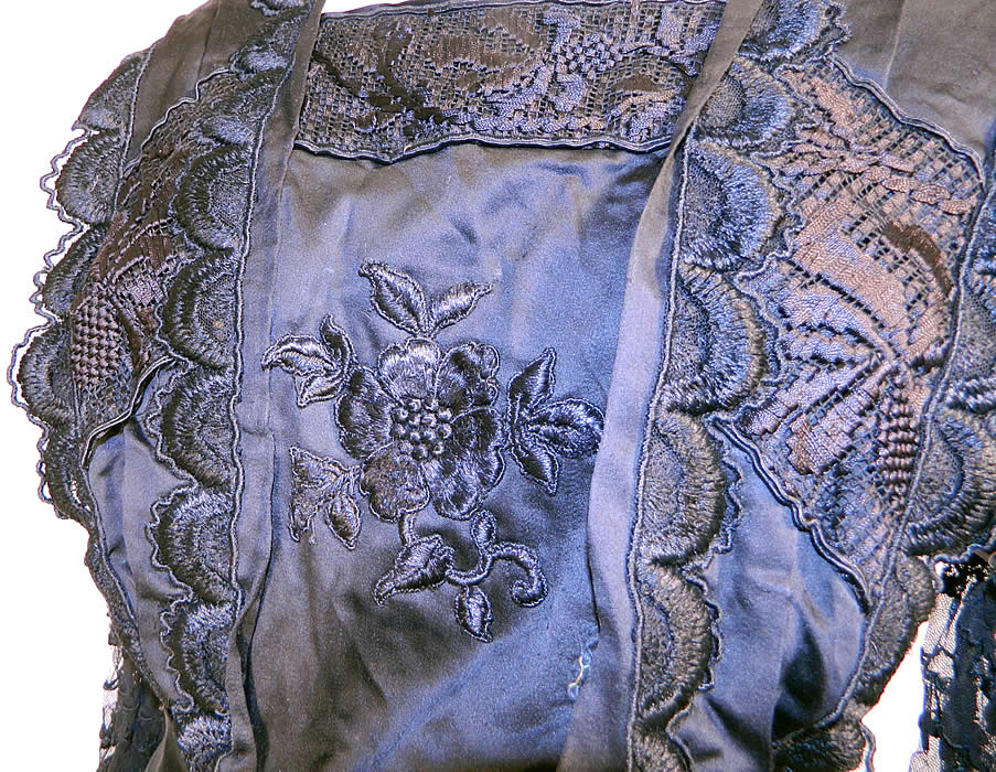 Edwardian Embroidered Black Silk Lace Applique Art Nouveau Dress. The dress measures 58 inches long, with 36 inch hips, a 26 inch waist, 36 inch bust, 14 inch back and 26 inch long sleeves.