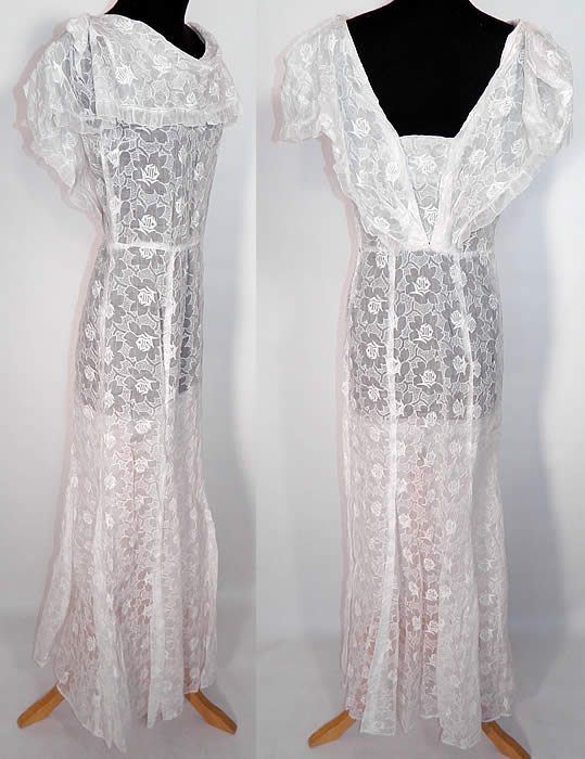 Vintage White Organdy Embroidered Roses Shawl Collar Dress. This sensational summer dress has a large layered flounce ruffle shawl style collar capelet, sleeveless, with a plunging V back, side snap closures and long floor length skirt.