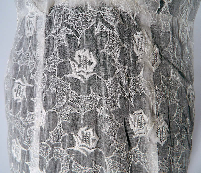 Vintage White Organdy Embroidered Roses Shawl Collar Dress. The dress measures 55 inches long, with 36 inch hips, a 26 inch waist and 34 inch bust. It is in good condition. This is truly a wonderful piece of wearable art! 