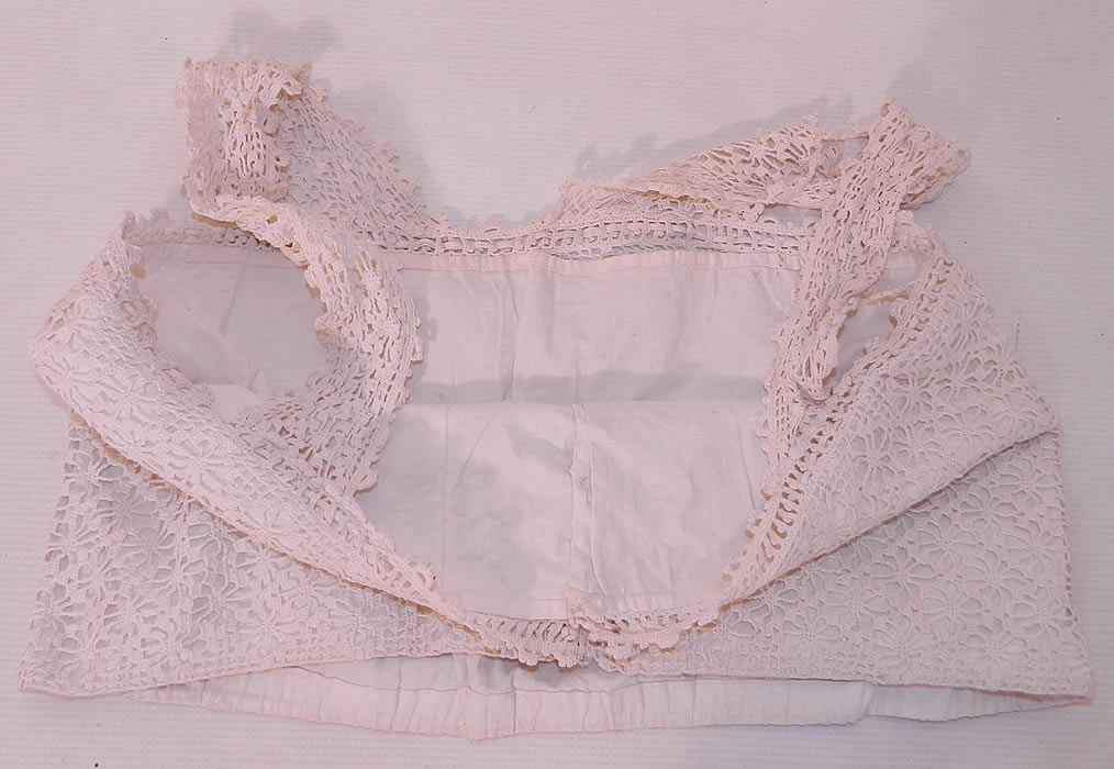 Edwardian White Cotton Crochet Lace Lingerie Camisole Top. This lovely lace lingerie camisole bra top undergarment has a squared neckline, lace shoulder straps and snap closures down the front. It is fully lined. The top measures 15 inches long, with a 32 inch waist and 34 inch bust.