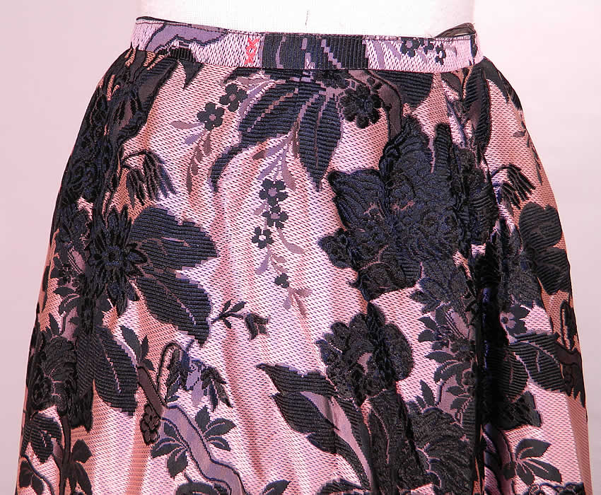 Victorian Pink & Black Floral Silk Damask Brocade Ball Gown Bustle Skirt. This gorgeous ball gown skirt is a long floor length, with a slight bustle back drape, hook closure on the waistband and is fully lined in a black polished cotton fabric with straps underneath for added fullness.