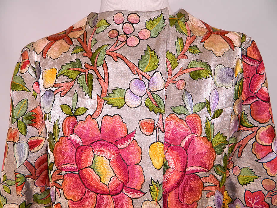 Vintage Silver Metallic Lam&eacute; Silk Embroidered Floral Leaf Coat Jacket. It is custom made of a silver metallic silk lam&eacute; fabric, covered with colorful beautifully done raised padded satin stitch hand embroidery work designs with a variety of embroidered flowers, leaves and branches.