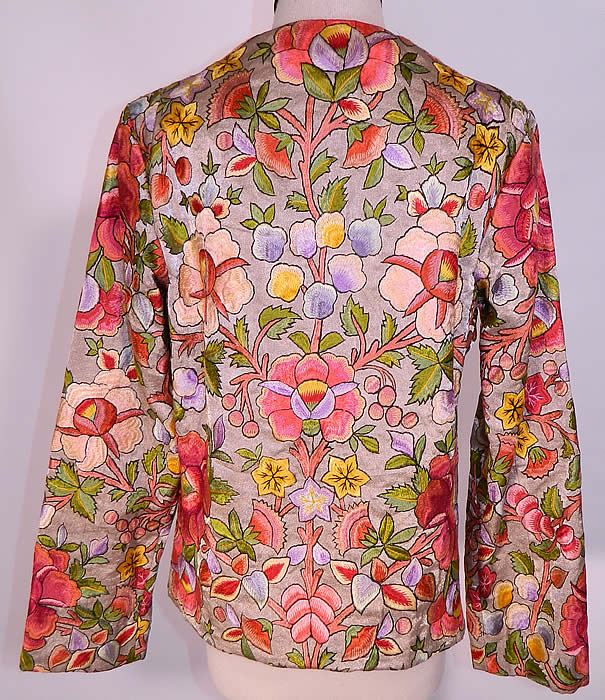 Vintage Silver Metallic Lam&eacute; Silk Embroidered Floral Leaf Coat Jacket. The coat measures 22 1/2 inches long, with a 36 inch waist, 36 inch bust, 13 inch back and 23 inch long sleeves. It is in excellent condition. This is truly an exceptional piece of wearable textile art! 