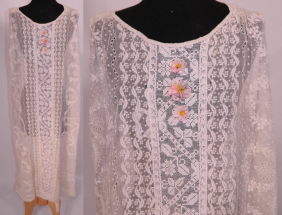 Vintage Silk Rosette White Embroidered Net Filet Lace Drop Waist Chemise Dress. This exquisite vintage silk rosette white embroidered net filet lace drop waist chemise dress dates from the 1920s. It is made of an off white sheer net fabric, with raised padded satin stitch embroidery work, filet lace inserts done in a decorative floral vine leaf pattern design and drawn cut work. 