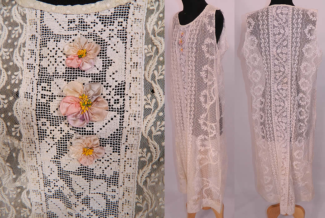 Vintage Silk Rosette White Embroidered Net Filet Lace Drop Waist Chemise Dress. There are three pretty pastel silk rosette ribbon work applique trim sewn onto the front neckline. This lovely lace drop waist dress is loose fitting, with a chemise straight shift style, sleeveless, with a rounded neckline and is sheer, unlined. The dress measures 46 inches long, with 42 inch hips, a 42 inch waist and 40 inch bust.